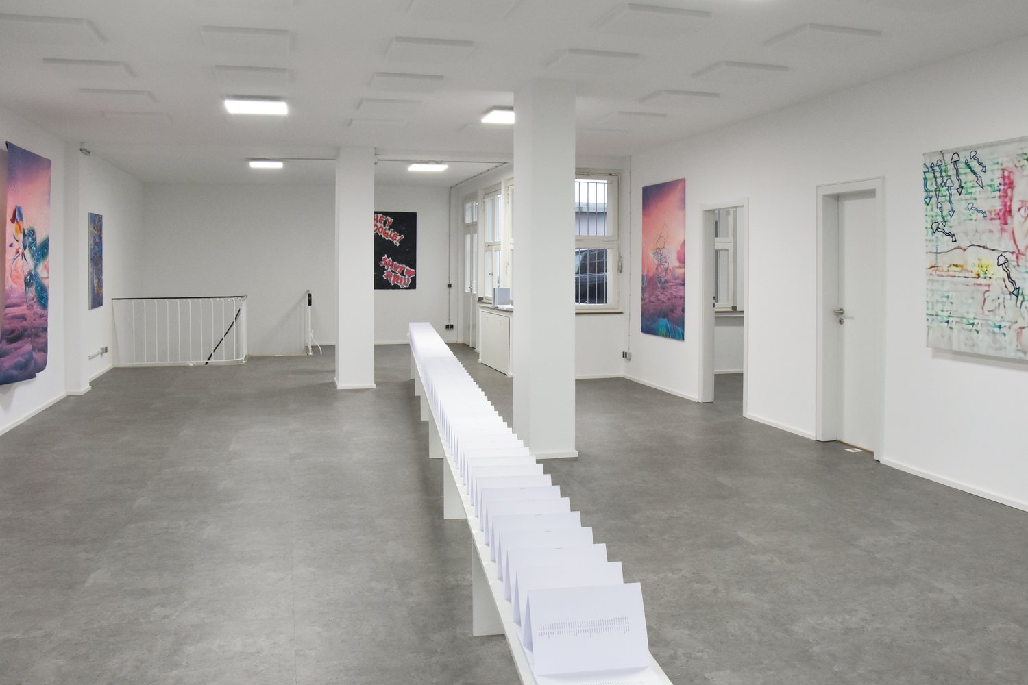 AUTOMATIC DREAMS — the gallery seen down its length, works and folded-paper sculpture