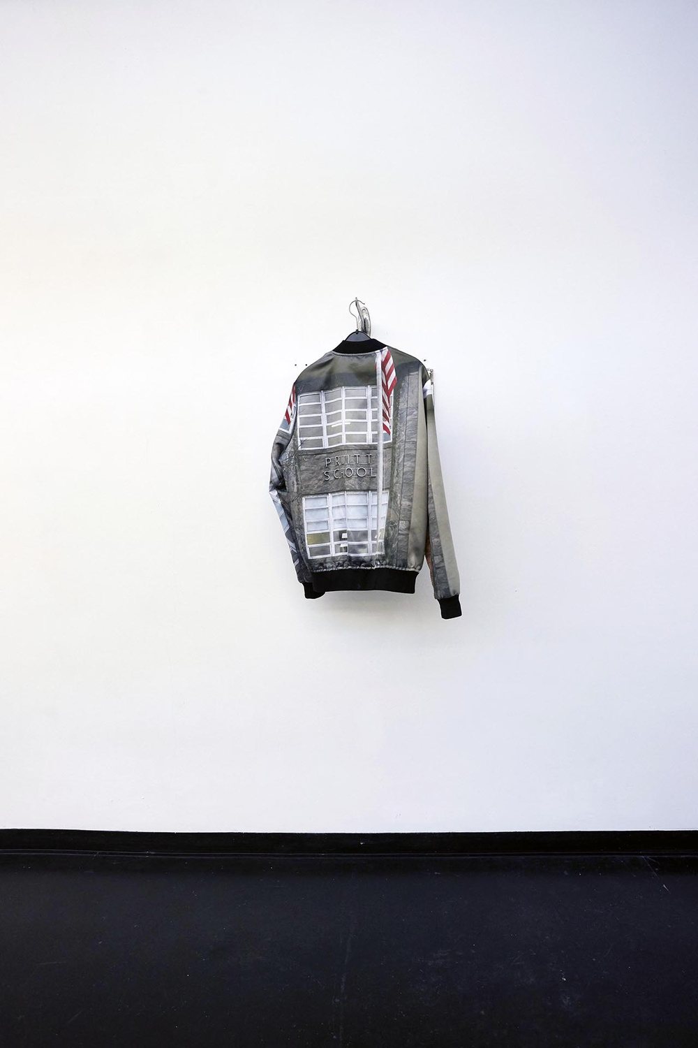 HIGH RES LOW BROW — a single printed bomber jacket on the wall