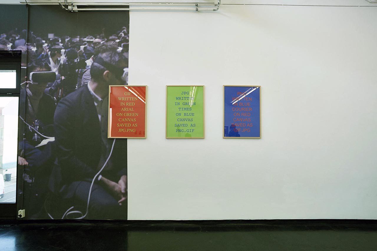 HIGH RES LOW BROW — tweets materialised on the wall beside the crowd photo