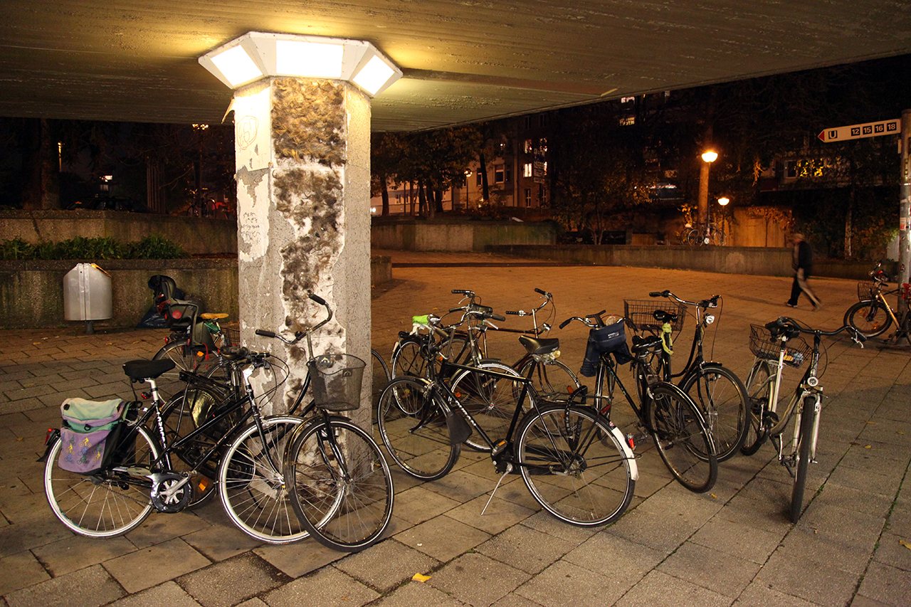 LSDSL — Ebertplatz at night, bikes parked outside the space