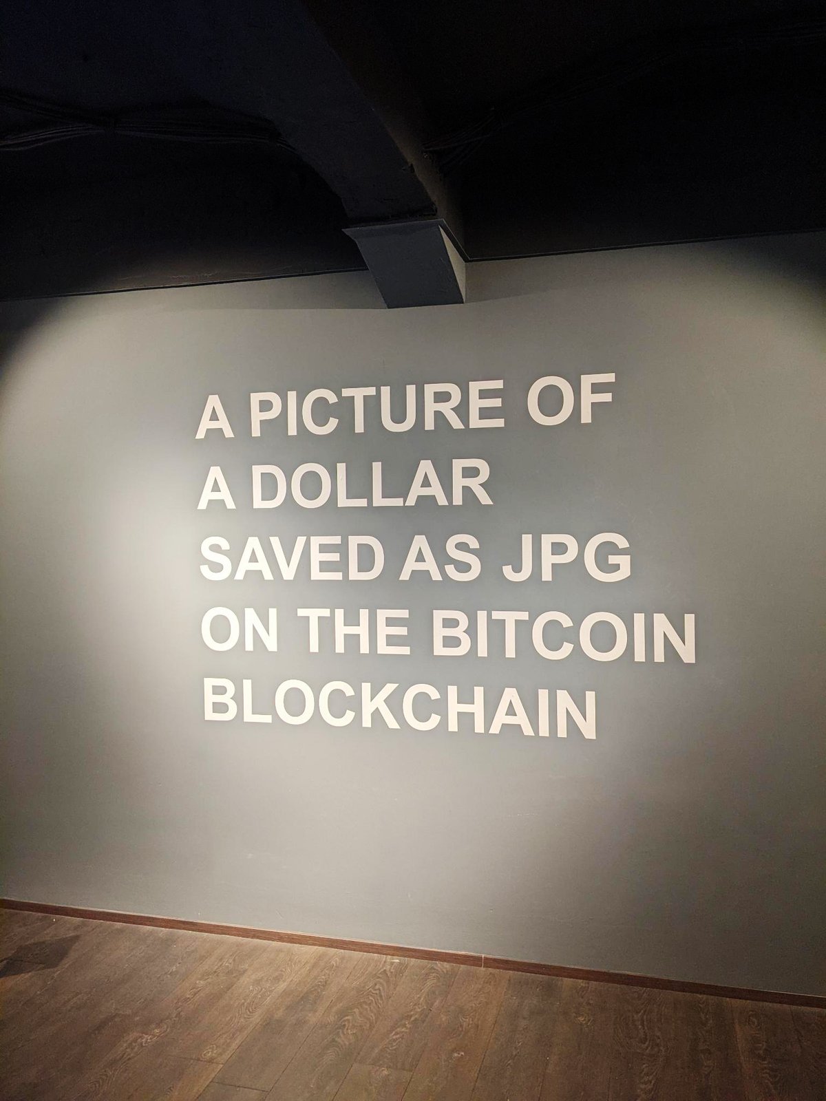 TRIBUTE TO GUY — the wall text A PICTURE OF A DOLLAR SAVED AS JPG ON THE BITCOIN BLOCKCHAIN