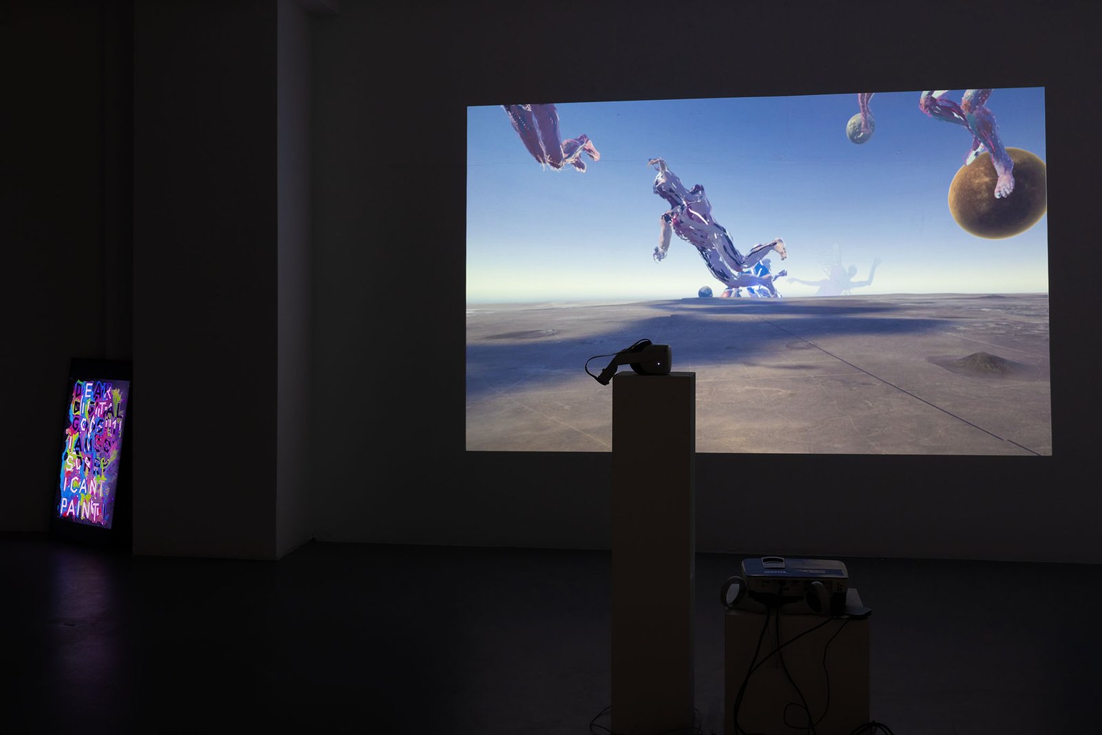 Dennis Rudolph's VR work DAS PORTAL projected, the bronze bust in front